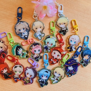 Puede incluir: Una colección de 15 llaveros coloridos de personajes de anime. Cada llavero presenta un personaje diferente con un diseño único y colores vibrantes. Los llaveros están hechos de acrílico transparente y tienen un anillo de metal para sujetarlos a llaves o bolsos.