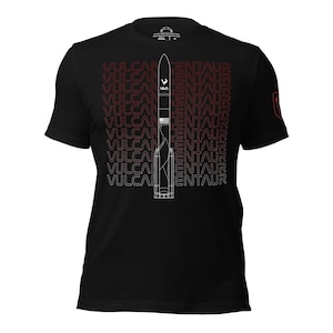 May include: Black t-shirt with a white outline of a rocket ship and the words "Vulcan Centaur" repeated in a gradient pattern from red to white.
