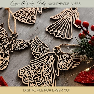May include: Laser-cut wooden angel ornaments featuring intricate filigree patterns and attached jute twine loops. The text Laser Ready Files SVG DXF CDR AI EPS and DIGITAL FILE FOR LASER CUT is visible at the top and bottom of the image.