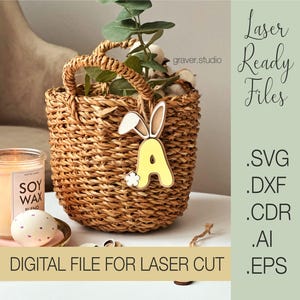 May include: A yellow wooden letter A with bunny ears and a flower, in a wicker basket. The text "Laser Ready Files" is in the top right corner of the image. The text ".SVG .DXF .CDR .AI .EPS" is in the bottom right corner of the image. The text "DIGITAL FILE FOR LASER CUT" is in the bottom left corner of the image.