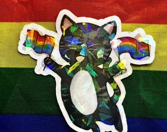 May include: A holographic sticker of a black cat holding two rainbow flags, set against a rainbow flag background. The cat has a white belly and is outlined in white. The sticker has a reflective, iridescent finish.