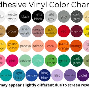 May include: Adhesive vinyl color chart with a variety of colors, including white, black, grey, and cream. The chart also features shades of brown, gold, red, pink, green, and blue. Text at the top reads "Adhesive Vinyl Color Chart 1".