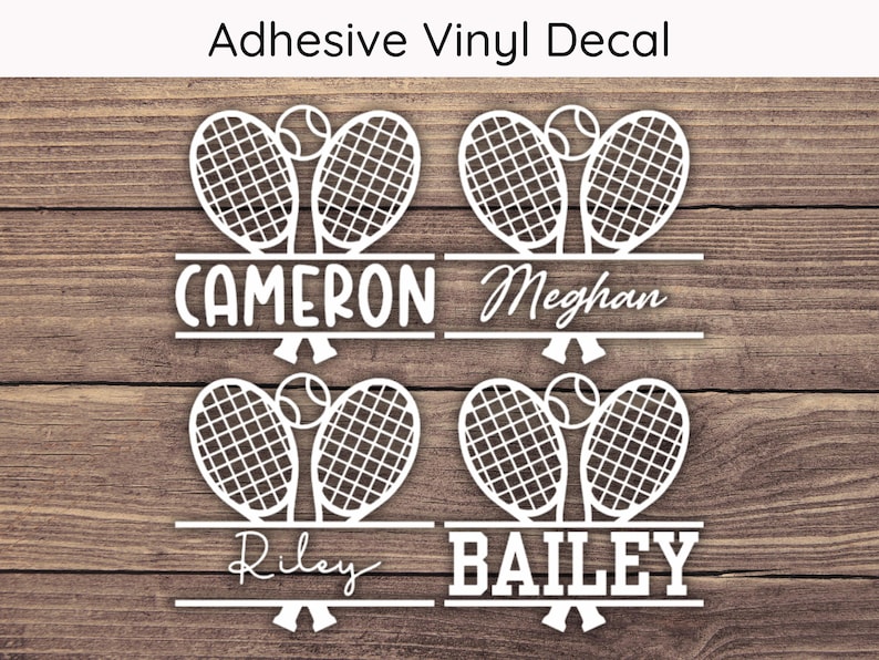 May include: White vinyl decal featuring tennis rackets and balls, with names Cameron, Meghan, Riley, and Bailey. The text "Adhesive Vinyl Decal" is at the top. The design is set against a wood grain background.