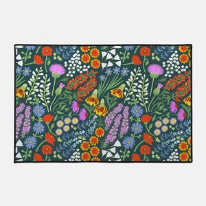 May include: A teal blue background with a repeating pattern of colorful wildflowers. The flowers include red poppies, purple thistles, yellow and orange wildflowers, and white and blue wildflowers.