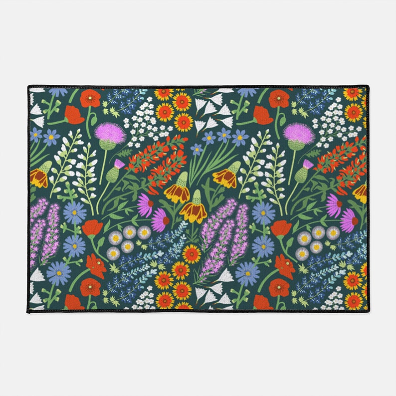 May include: A teal blue background with a repeating pattern of colorful wildflowers. The flowers include red poppies, purple thistles, yellow and orange wildflowers, and white and blue wildflowers.