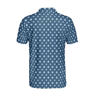 May include: A blue short-sleeved polo shirt with a pattern of light blue hand gestures.