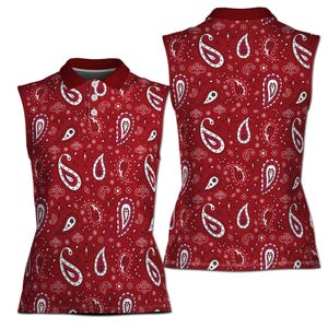May include: Sleeveless red polo shirt with a paisley pattern in white and burgundy. The shirt has a burgundy collar and a three-button placket. The back of the shirt is also visible, showing the same paisley design.