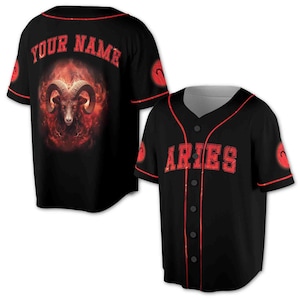 May include: Black baseball jersey with red trim and a red and orange graphic of a ram's head with flames. The back of the jersey says "YOUR NAME" in red letters.