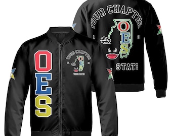 May include: Black bomber jacket with a zipper closure. The left side of the jacket features a vertical design of the letters "OES" in red, blue, and yellow. The right side of the jacket features a black and white illustration of a woman's face with the letters "OES" in a circle around her head. The text "YOUR CHAPTER" and "STATE" are printed on the jacket.