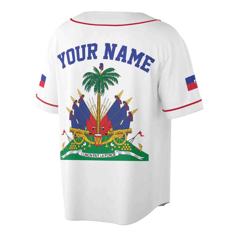 May include: White baseball jersey with a red trim and the coat of arms of Haiti on the back. The text "YOUR NAME" is printed in blue above the coat of arms.