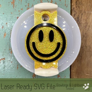 May include: A laser-cut SVG file of a yellow smiley face with glitter. The file is ready to be used with Glowforge and Lightburn.