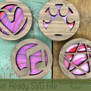 May include: Four wooden coasters with laser cut designs. Each coaster features a different geometric shape with a pink and red marbled background. The coasters are labeled "Laser Ready SVG File Glowforge & Lightburn Tested".
