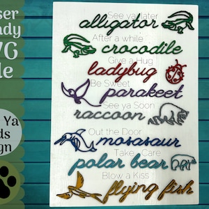May include: A white wooden sign with colorful cut-out animal shapes and phrases. The phrases include "See ya later alligator", "After a while crocodile", "Give a hug ladybug", "Be sweet parakeet", "See ya soon raccoon", "Out the door mosasaur", "Take care polar bear", and "Blow a kiss flying fish".