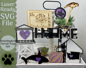 May include: Laser cut tiered tray set with a black and white checkered design. The set includes a water tower with a purple heart that says "WA", a black and white "HOME" sign, a purple heart with a whale, a purple onion, and a black outline of Washington state with a purple heart.