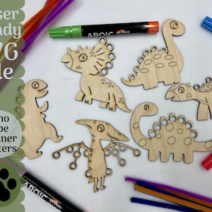 May include: Six unfinished wooden dinosaur shapes with holes for pipe cleaners. The dinosaurs are a triceratops, stegosaurus, pterodactyl, and three different types of long-necked dinosaurs. The dinosaurs are on a white surface with pipe cleaners and markers.