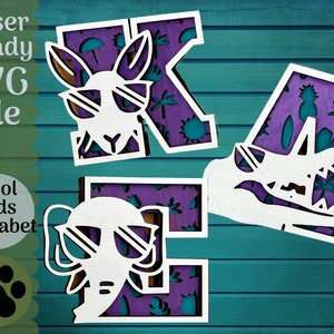 May include: Laser cut SVG file of the letters K, A, and E. Each letter is decorated with a purple and teal tropical pattern. The K features a white silhouette of a kangaroo wearing sunglasses, the A features a white silhouette of an alligator with its mouth open, and the E features a white silhouette of an elephant wearing sunglasses.