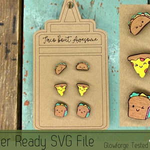 May include: A set of six laser-cut wooden earrings featuring various food designs. The earrings are displayed on a brown card with the text "Taco Bout Awesome". The designs include a taco, pizza slice, and sandwich.