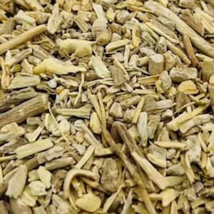 May include: Close-up of a pile of dried, light brown and beige plant pieces. The pieces vary in size and shape, with some appearing like small sticks and others like flattened fragments. The texture appears rough and natural.