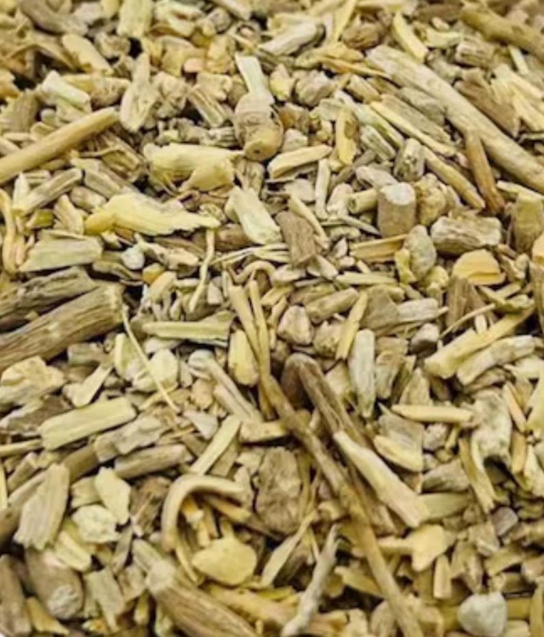 May include: Close-up of a pile of dried, light brown and beige plant pieces. The pieces vary in size and shape, with some appearing like small sticks and others like flattened fragments. The texture appears rough and natural.