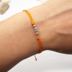 Orange bracelet with beads | Surfer armband | Waxed cord waterproof bracelet | Beaded unisex bracelet | Adjustable size jewelry for wrist