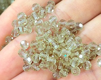 Perline di cristallo da 4 mm color melone - Cambiano colore alla luce del sole - Equivalenti a Swarovski Art. 5000 - Disponibili diverse opzioni di quantità