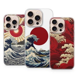 May include: Three smartphone cases featuring artistic designs. The left case shows a sun, clouds, and waves. The center case displays a large red sun over a wave and mountain. The right case features a pattern of red and cream-colored stylized waves.