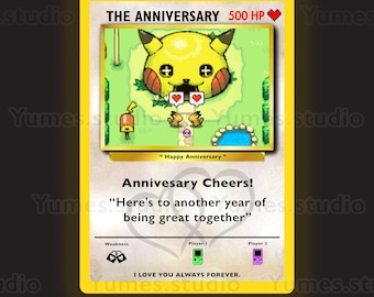 May include: A yellow and black Pokemon card with a Pikachu illustration. The card reads "The Anniversary 500 HP" and "Happy Anniversary". The text also reads "Anniversary Cheers! Here's to another year of being great together".