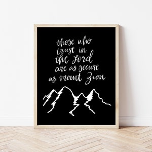 May include: Black and white printable wall art with a quote that reads "Those who trust in the Lord are as secure as Mount Zion" and a stylised image of mountains.