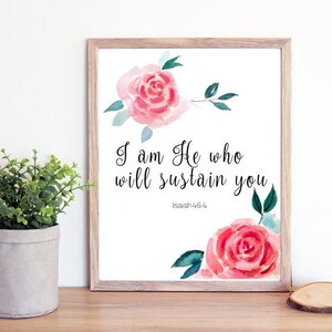 Puede incluir: Una impresión de acuarela con rosas rosadas y hojas verdes. La impresión presenta el texto "Yo soy Él que te sostendrá" con la referencia bíblica "Isaías 46:4".
