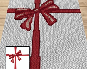 May include: A white crocheted blanket with a red ribbon and bow. The blanket is made with a textured stitch and has a simple design.