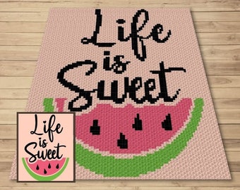 May include: A crochet pattern featuring a watermelon with the text "Life is Sweet" in black lettering on a pink background.