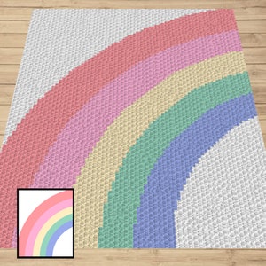 May include: A crocheted rainbow rug with a white background. The rainbow is made up of six colours: red, pink, yellow, green, blue, and purple.
