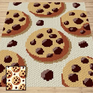 May include: A crochet pattern featuring a repeating design of chocolate chip cookies. The cookies are brown with dark brown chocolate chips and a light brown outline. The background is white with a subtle texture.