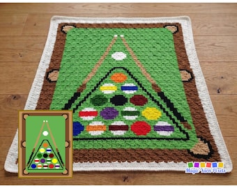 May include: A C2C billiard pool table blanket featuring a green felt surface, brown rails, and a rack of colorful billiard balls with two cues. The design includes a white border and the text C2C BILLIARD POOL TABLE BLANKET WRITTEN PATTERN & GRAPH.