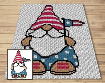 May include: A pixelated gnome design with a red and white striped hat and a blue outfit with white polka dots. The gnome is holding a small flag with a star. The design is on a light gray background.