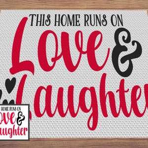 May include: White doormat with black and red text that reads "This home runs on love & laughter". There are three black hearts on the left side of the mat.