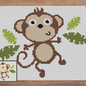 Puede incluir: Un diseño de mono pixelado en tonos marrones y beige, con ojos negros y una expresión sonriente, se presenta sobre un fondo blanco. Hojas verdes están dispersas alrededor del mono. Una versión más pequeña del diseño está en la esquina inferior izquierda.