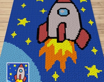 May include: A blue crochet blanket with a rocket ship design. The rocket ship is red, white, and orange and is flying through a starry night sky. The blanket is perfect for a child's room.