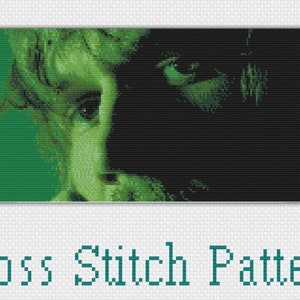 May include: Cross stitch pattern of a person's face, half in shadow and half in green light.