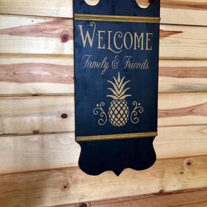 Welcome pineapple Tavern sign