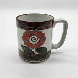 Caneca de grés floral salpicado vintage