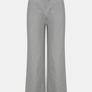 May include: Grey wide-leg sweatpants with a drawstring waist.