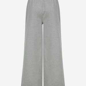 May include: Grey wide-leg sweatpants with an elastic waistband.
