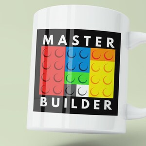 May include: White ceramic mug with a black square design featuring the text "MASTER BUILDER" in white letters. The square also contains a colorful pattern of red, blue, green, yellow, black, and white Lego bricks.