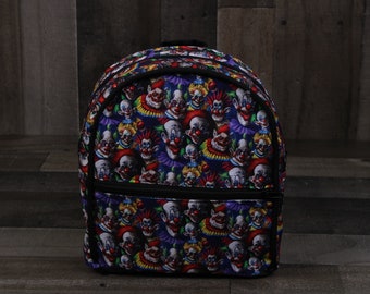 ISO Killer Klowns Black Multi-Color Tote Backpack with Clown Charm Killer Klown merchandise is making its way to the parks  main image 4
