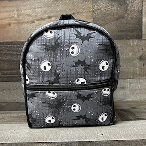 jack skeleton mini backpack Loungefly Exclusive Nightmare Before Christmas Angry Skellington - A Must-Have Disney Collector's Item for NBC Fans It is made of faux leather and features a top zipper closure and front zippered pocket The Nightmare Before Christmas Jack