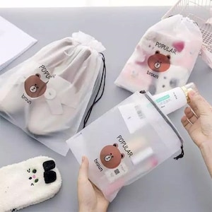 旅行用ポーチ メイクアップケース コスメバッグ バス用品 オーガナイザー 巾着 半透明 3個セット 小、中、大