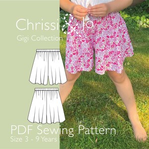 May include: A pair of pink and white floral shorts with an elastic waistband. The image includes the text Chrissi & Jo Gigi Collection PDF Sewing Pattern Size 3 - 9 Years and two black and white line drawings of the shorts design.