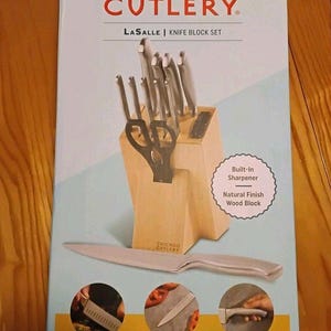 May include: Chicago Cutlery LaSalle knife block set with 12 pieces. The set includes a natural finish wood block, built-in sharpener, and high-quality stainless steel knives. Features include a 26-degree taper grind edge for sharpness and full metal tang for balance.