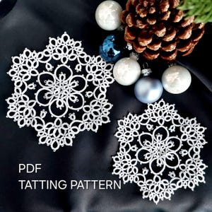 May include: Two white, snowflake-shaped tatting patterns are shown on a black surface, with Christmas baubles and a pine cone. The text "PDF TATTING PATTERN" is visible. The patterns are detailed and delicate.